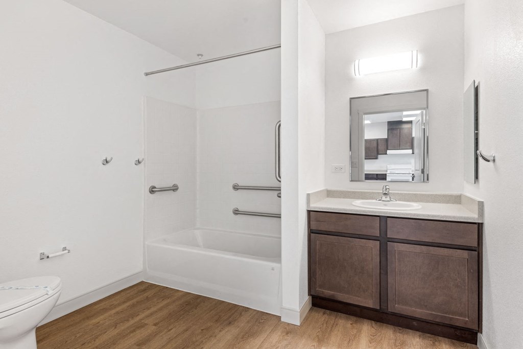 a bathroom with a toilet sink and bathtub