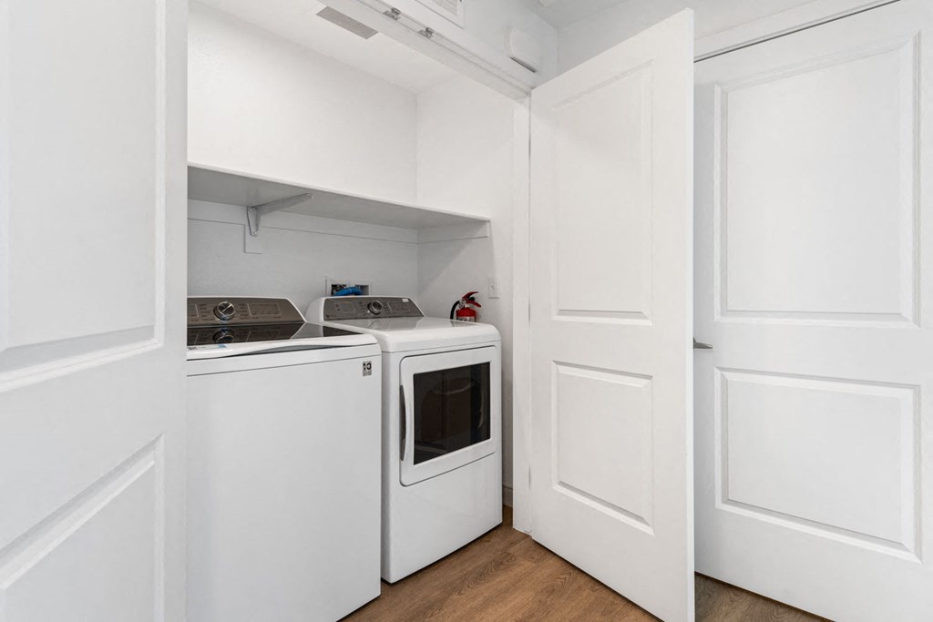 a laundry room with a washer and dryer