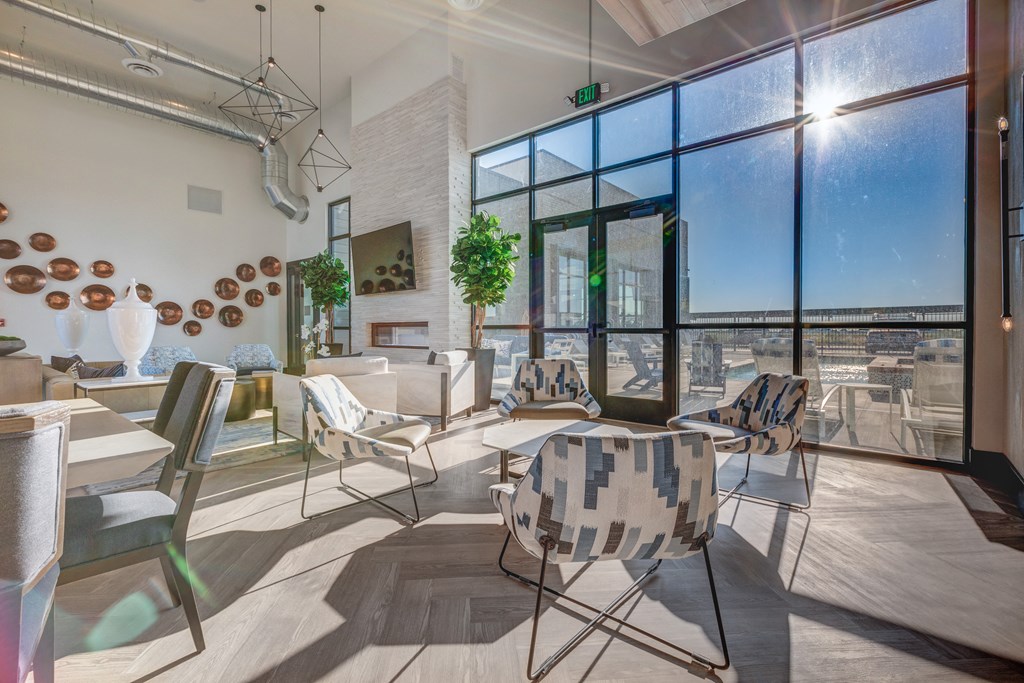 A sunny day in a modern room with a view of the city.