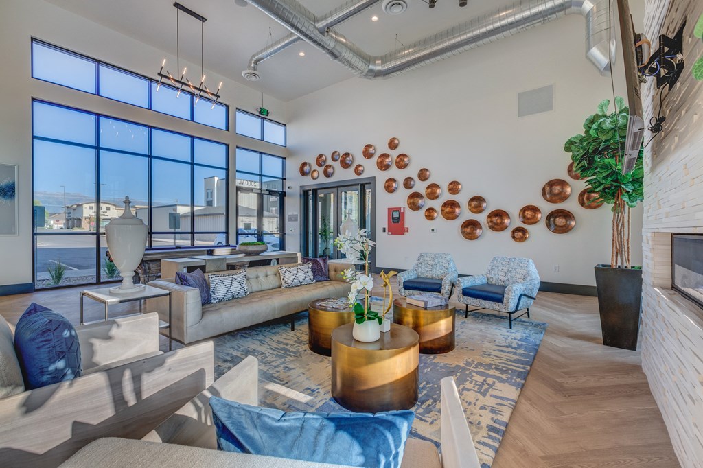 A modern living room with a large window and a view of the city.