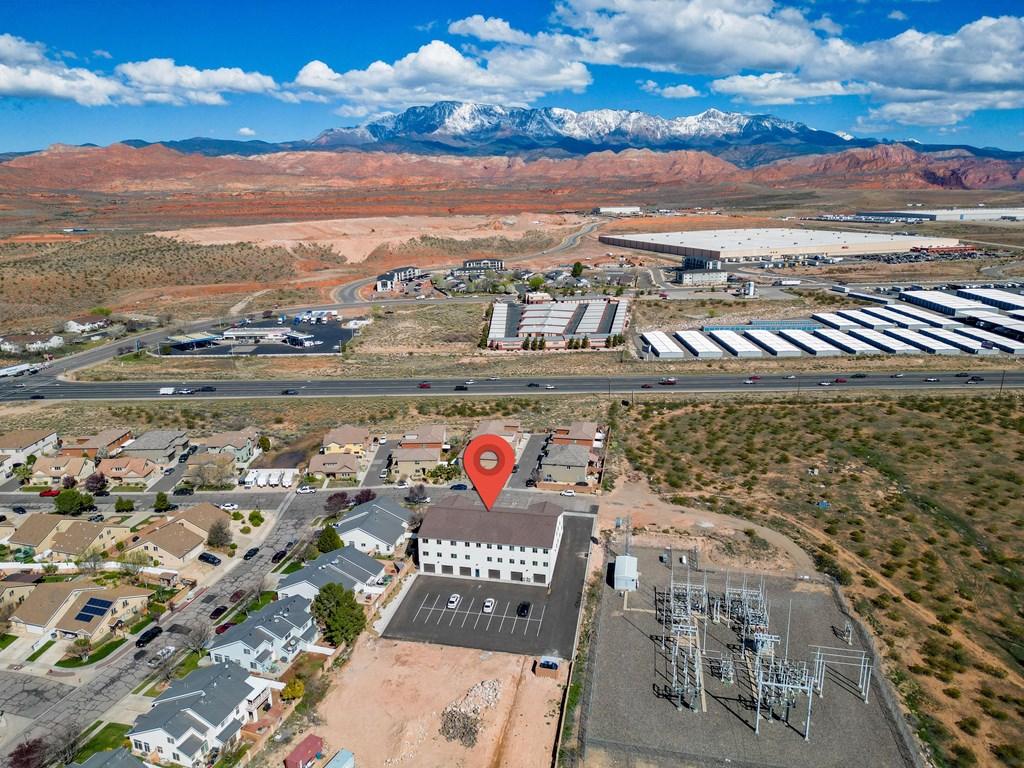 an aerial view of a building with a location icon on top of it