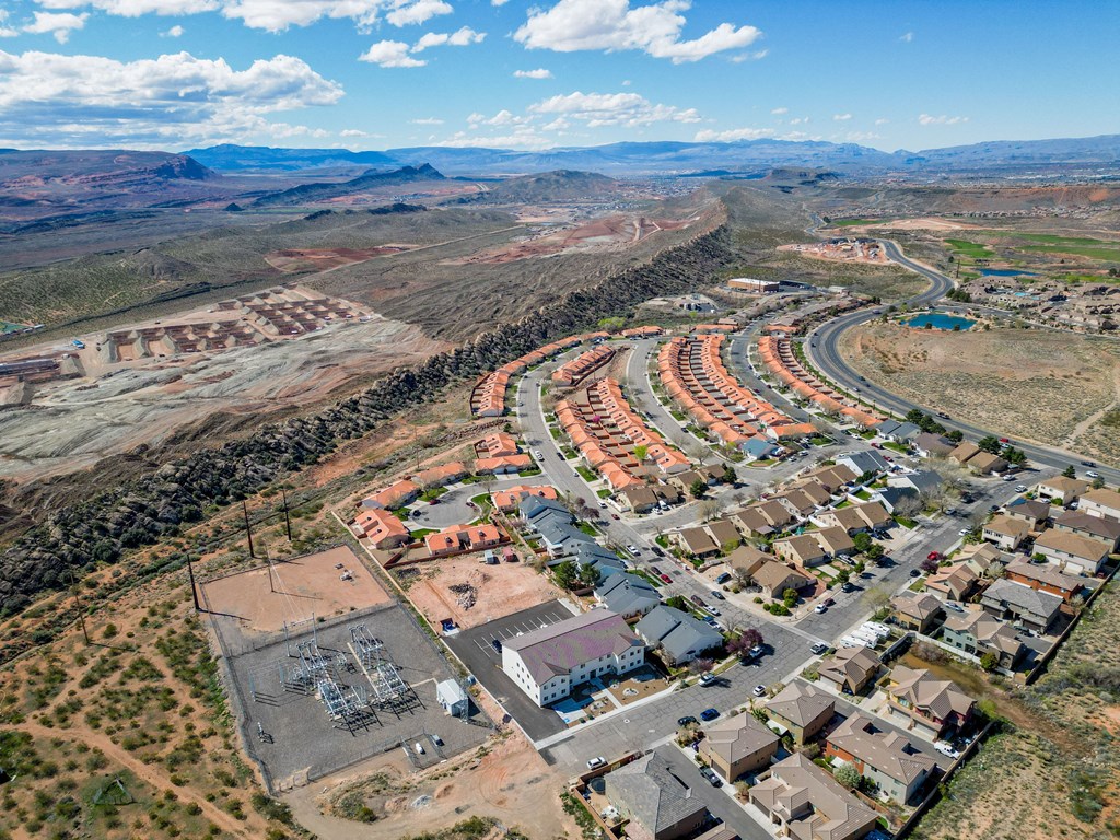 an aerial view of a community with houses and a road