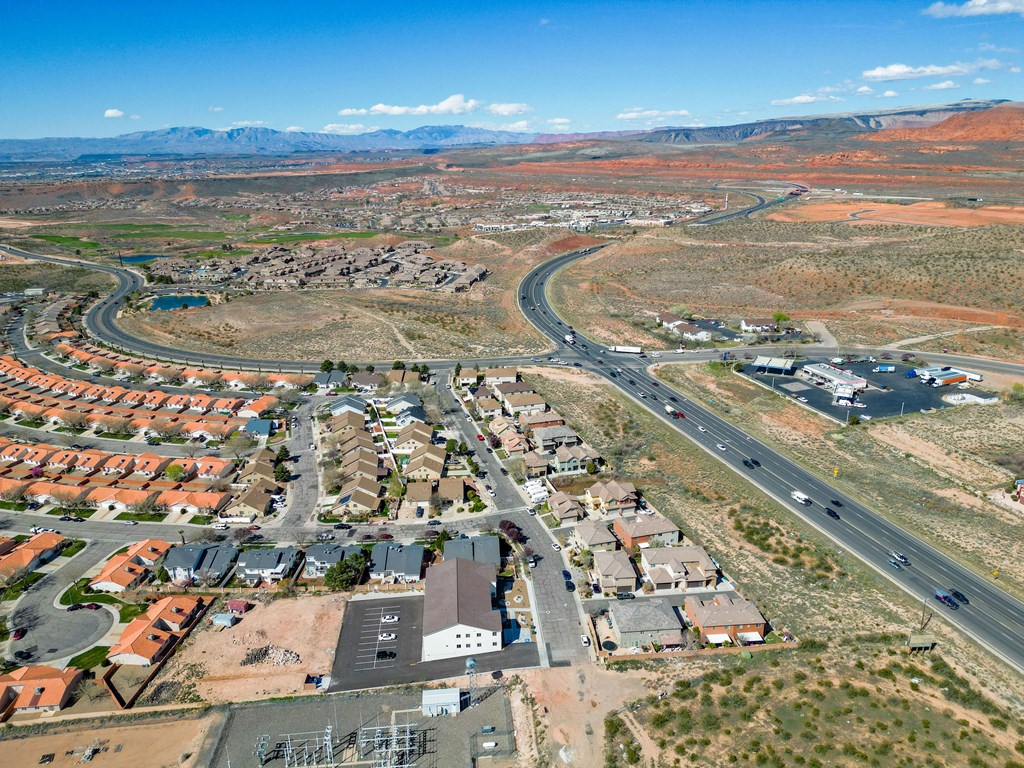 an aerial view of a city with an interstate highway in the middle of it