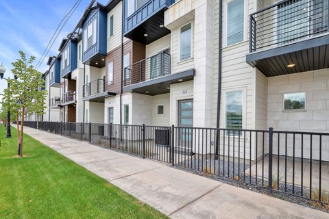 the preserve at cardinal heights apartments exterior view with sidewalk and grass