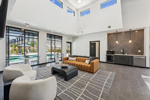 A modern living room with a pool view.