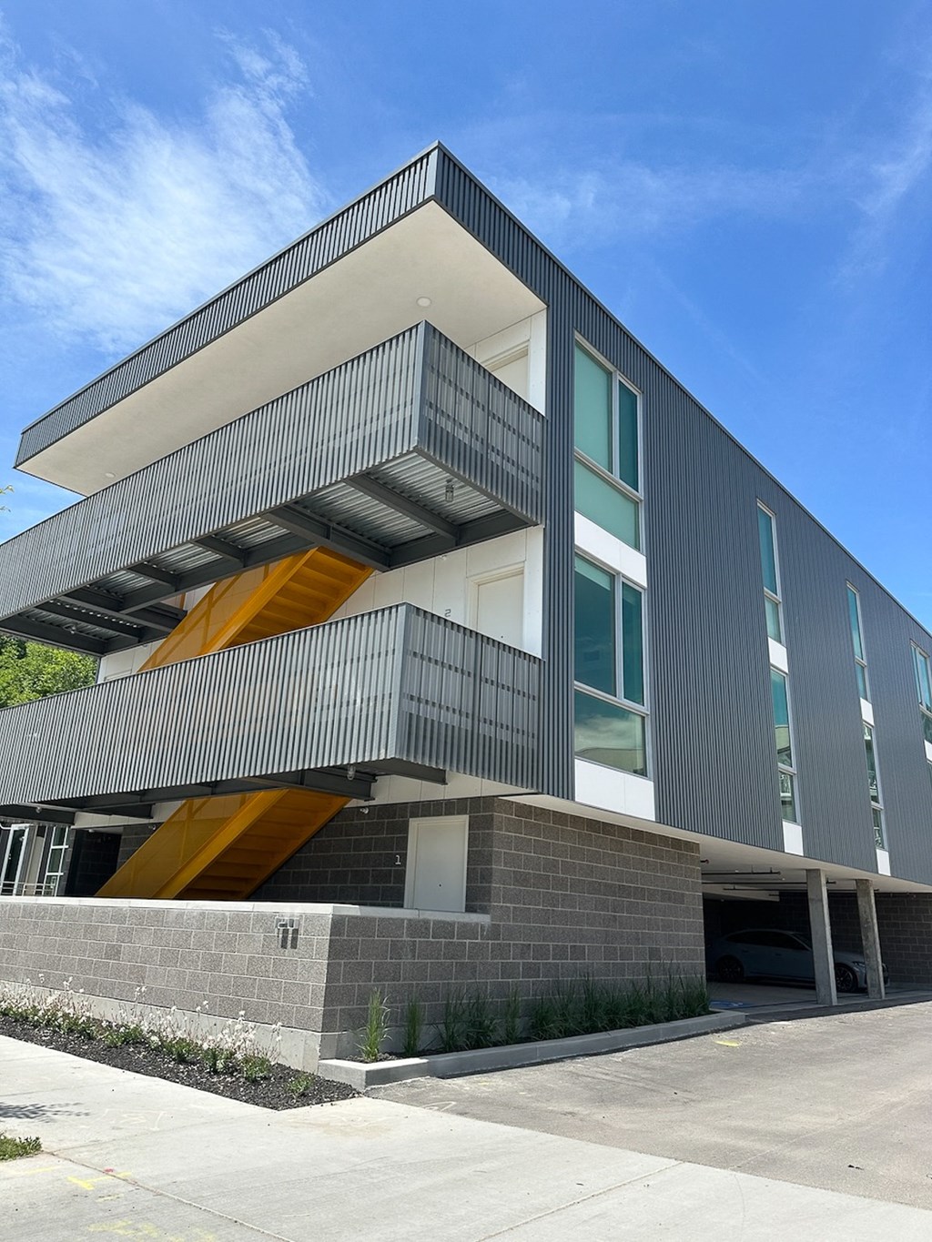 the front of a building with a sky background