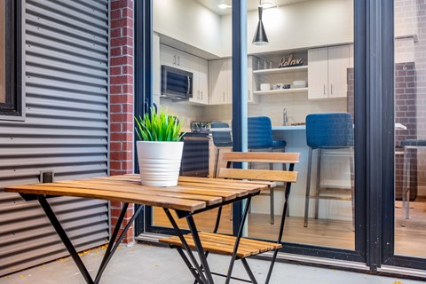 a dining area with a table and a window