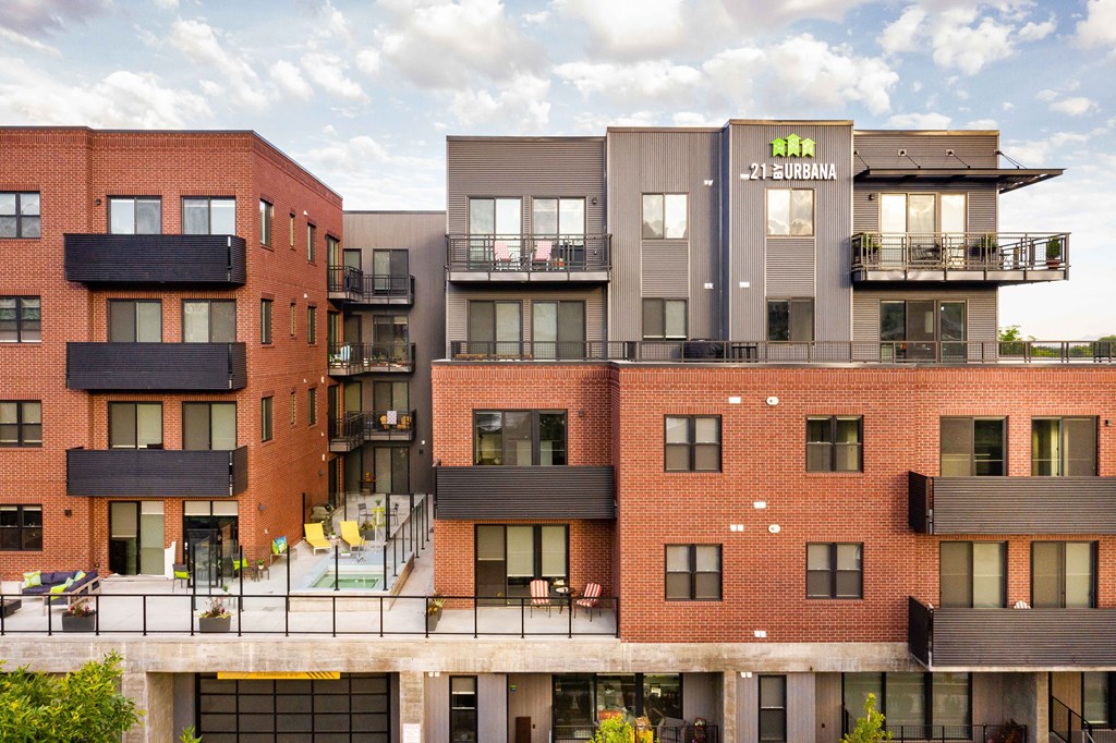 a rendering of a large apartment building with balconies