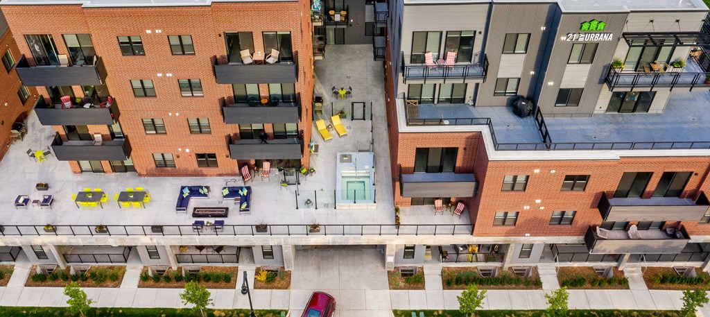 an aerial view of an apartment complex with buildings and a staircase