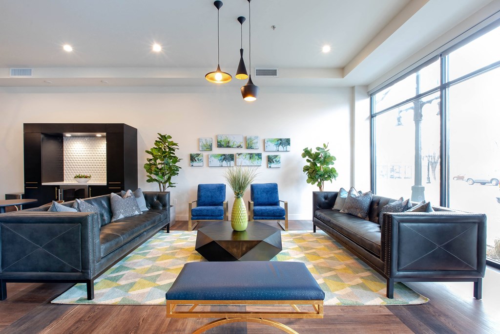a living room with couches and chairs and a coffee table