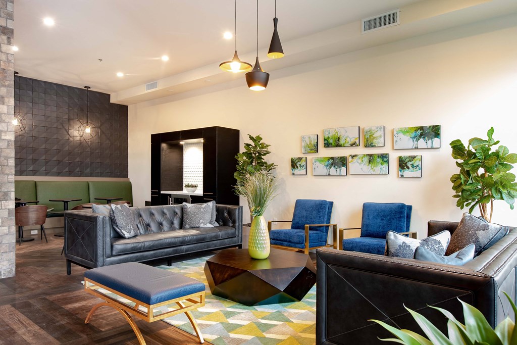 a living room with couches and chairs and a table