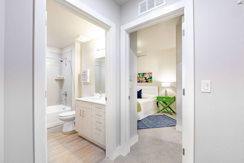 a view of a bathroom and a bedroom from a doorway