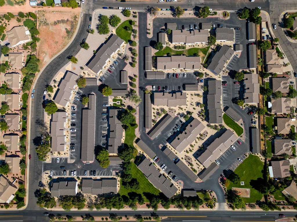 an aerial view of a parking lot in a residential area