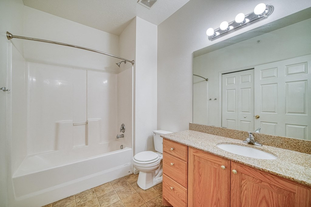 a bathroom with a toilet sink and bathtub