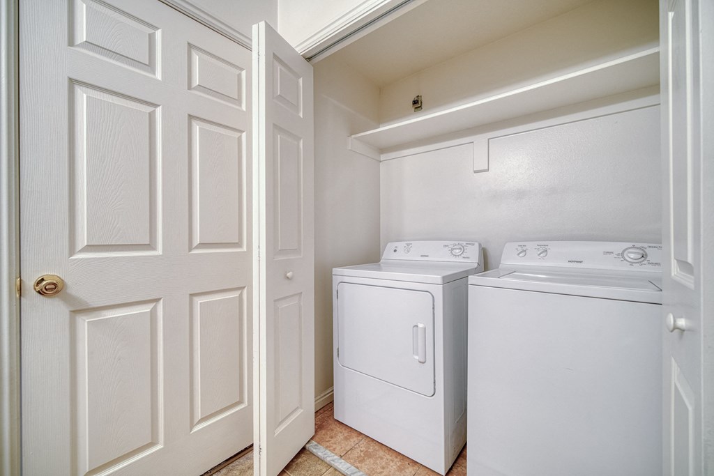 a laundry room with a washer and dryer
