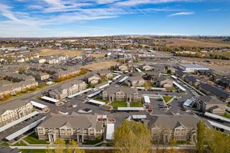 an aerial view of a neighborhood of houses in a parking lot