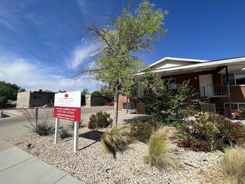 A building with a red sign in front of it.