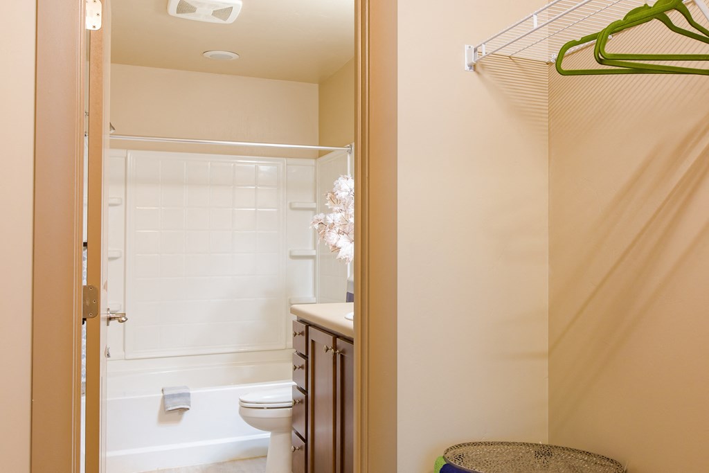 a bathroom with a shower and a toilet and a sink at Sugar House Apartments By Urbana, Salt Lake City, UT, 84105