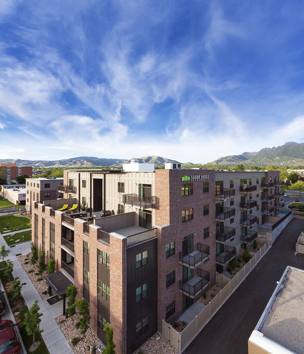 a rendering of a building with a blue sky in the background at Sugar House Apartments By Urbana, Salt Lake City, UT, 84105