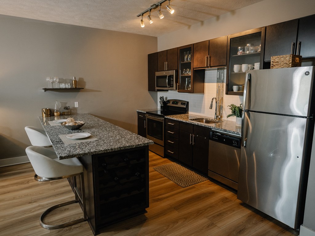 a kitchen with stainless steel appliances and granite counter tops