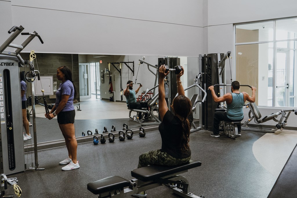 a group of people working out in a gym