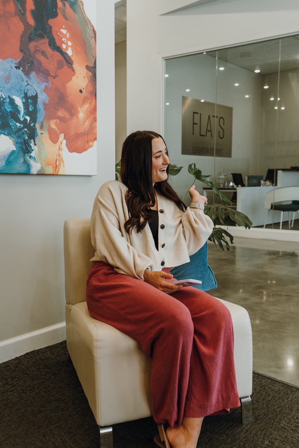 a woman sitting on a chair in an office