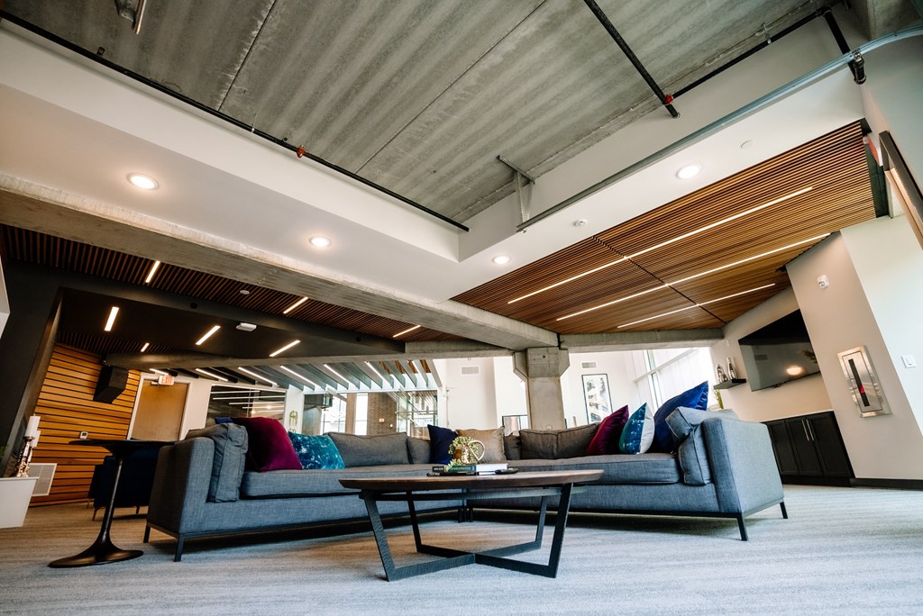 a living room with couches and a coffee table