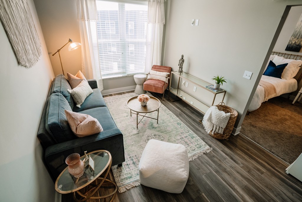 a living room with a couch and a mirror
