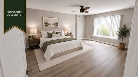 A bedroom with a large bed and a ceiling fan.