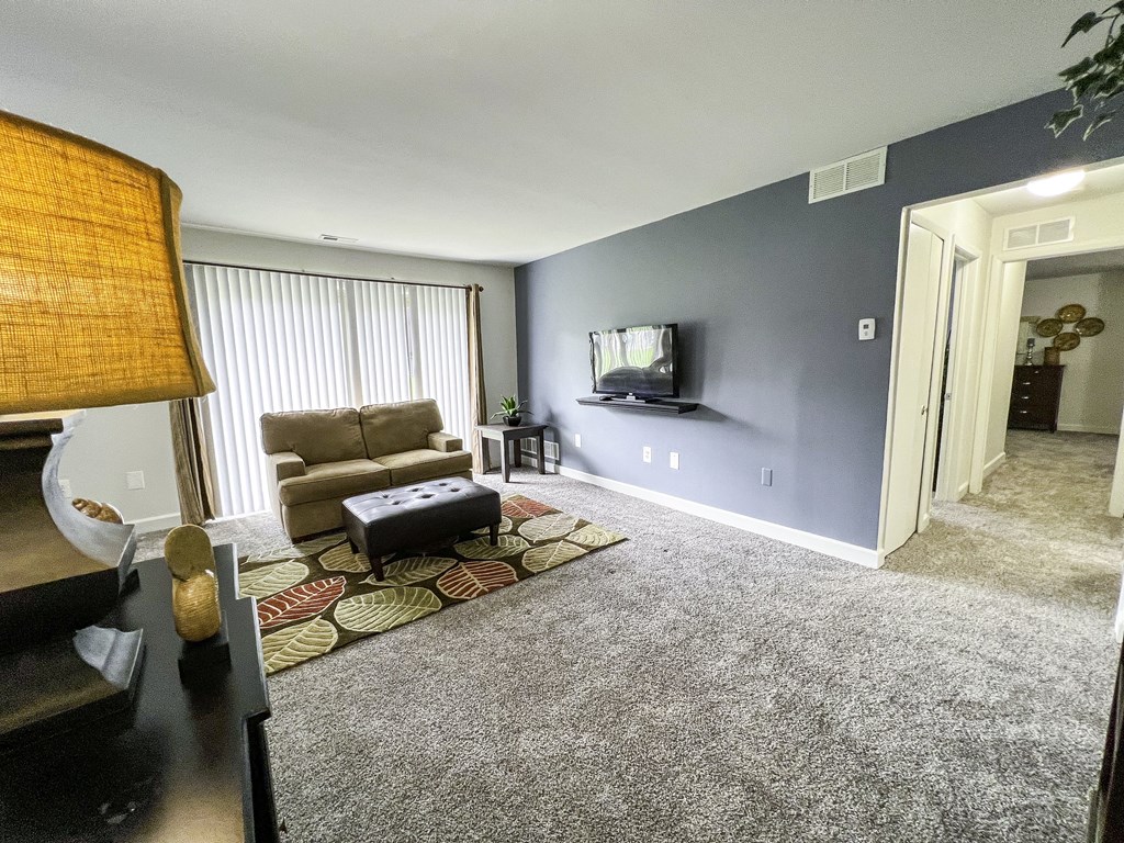 a living room with a couch and a tv