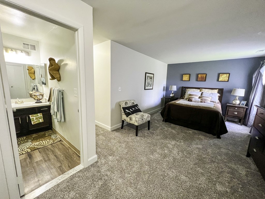 a bedroom with a large mirror and a bed