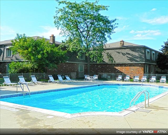 a swimming pool in front of a building