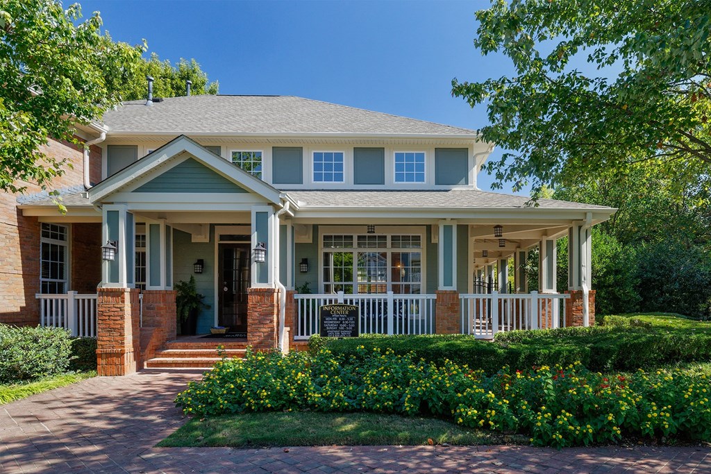 Belle Harbour Apartments clubhouse exterior with wraparound porch