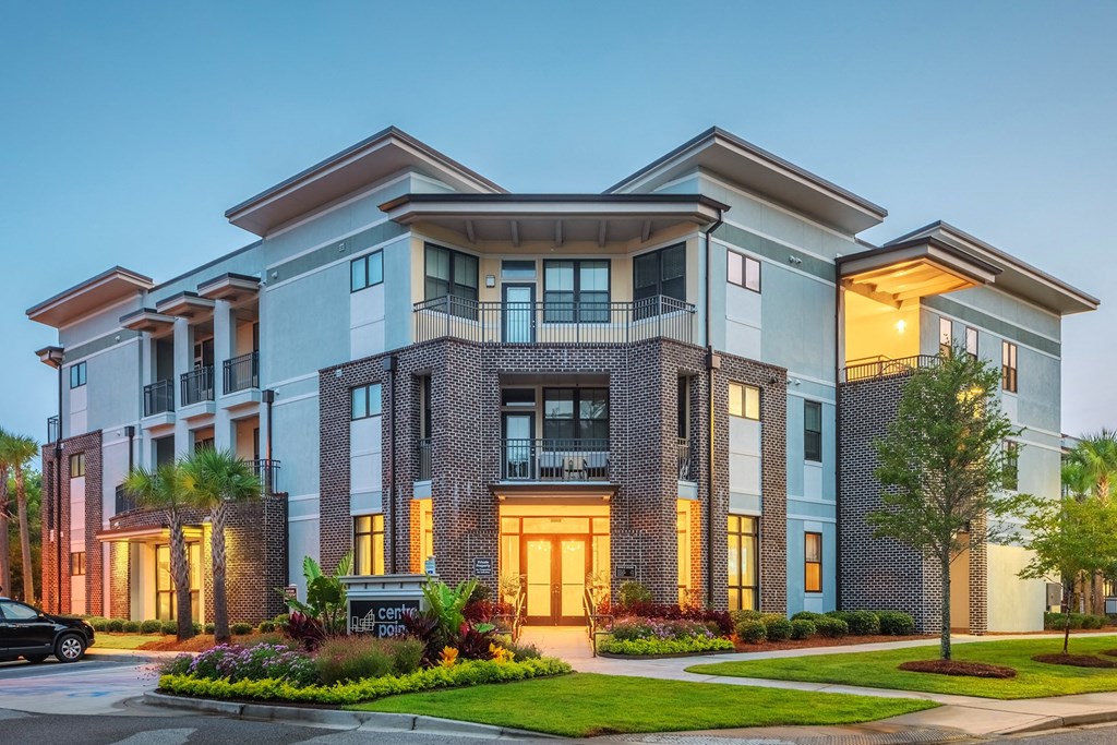 Centre Pointe Apartments entrance with landscaping and apartment balconies