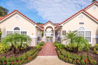 The Colony at Deerwood Apartments - Walkway to leasing office