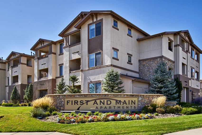 First and Main Apartments welcome sign and landscaping - Photo Gallery 1