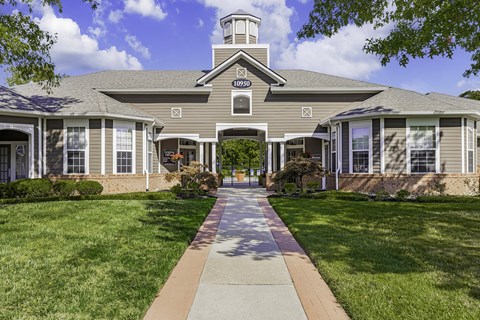 A building with a clock tower and the number 10290 on it.