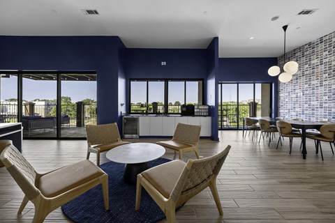 A modern living room with a round table and chairs.