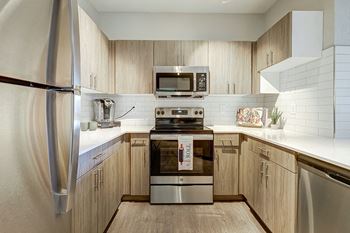Stainless steel appliances in select units - Emmersyn at Lone Tree
