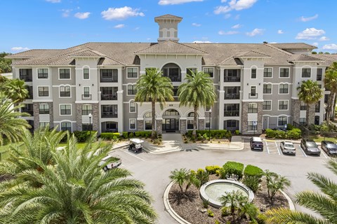 A large building with a courtyard in front of it.