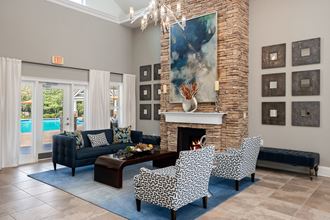 Carrington Place at Shoal Creek - Resident clubhouse Carrington Place at Shoal Creek - Resident clubhouse social area with fireplace - Photo Gallery