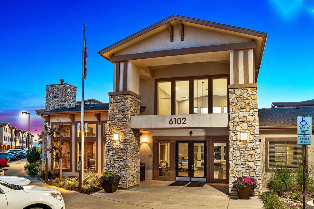 First and Main Apartments clubhouse entrance with large windows