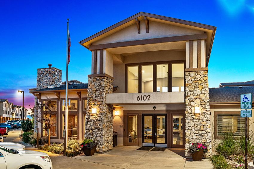 First and Main Apartments clubhouse entrance with large windows - Photo Gallery