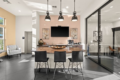 A modern kitchen with a dining table and chairs.