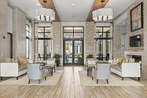 Resident clubhouse withe fireplace lounge - Nona Park Village Apartments