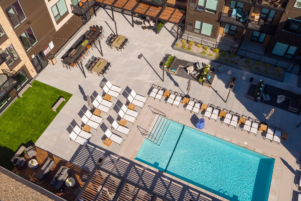 Large pool deck with ample lounge seating - Onyx Edina