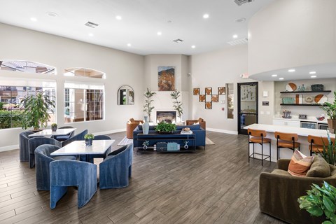 A living room with a blue couch and a coffee table.