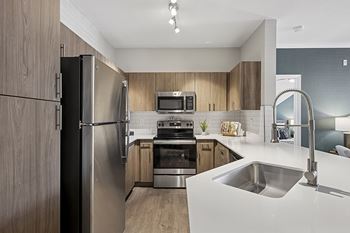 Stainless steel appliances in select units - Emmersyn at Lone Tree