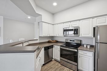 Stainless steel appliances - Grand Centennial Apartments