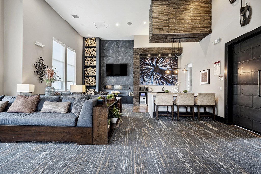 a living room with a couch and a table with chairs